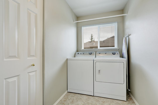 Small laundry room with old fashioned appliances.