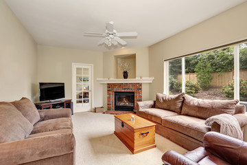 Cozy elegant family room with backyard view