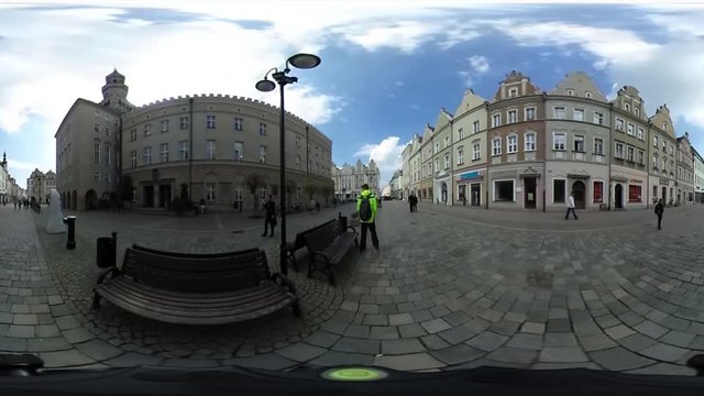 Backpacker in Yellow Jacket is Walking by Paving Stone and Crossing Road Spherical Panorama Video vr Video 360 Sunny Spring Day Blue Sky White Clouds