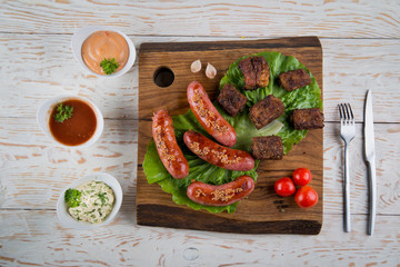 sausages and pork ribs grilled with beer