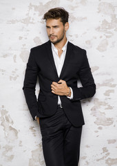 Portrait of sexy man in black suit