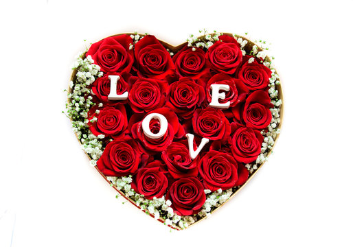 Lovely heart made of red roses isolated on white background good for mother's day too