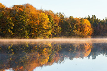 Lake at the forest in autumn colors