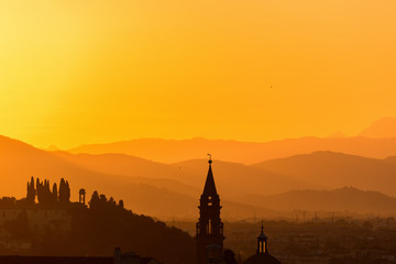 Fototapeta na wymiar Church tower in the sunset silhouette