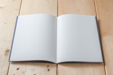 Recycled paper book on wooden background