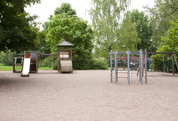 Children's playground with slide, climbing frame and rocking