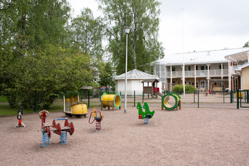 Obraz na płótnie Canvas Children's playground with slide, climbing frame and rocking