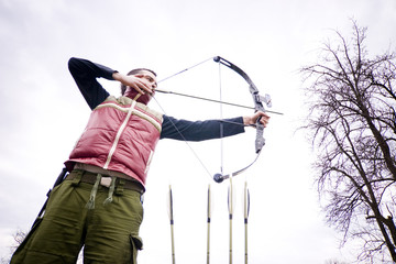Man aiming bow