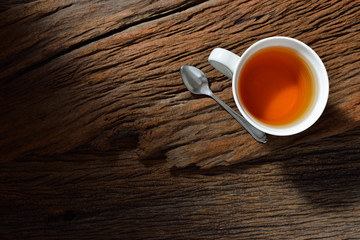 Top view of a cup of tea on wooden table