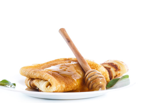 Thin pancakes with honey