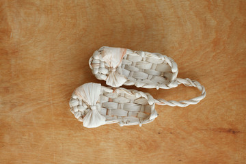 bast shoes on wooden background