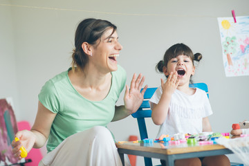 Mother and daughter  playing and having great time. 