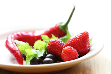 Pepper and strawberry in plate