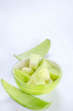 green melon in bowl