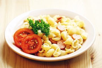 Plate with pasta and tomatoes
