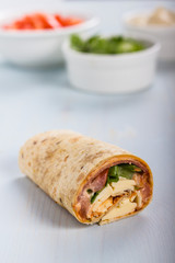 Wrap with tomato, lettuce, harissa and hoummous.
