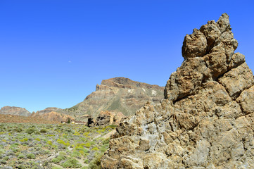 Fototapeta na wymiar Half moon over Mount Teide National Park in Tenerife