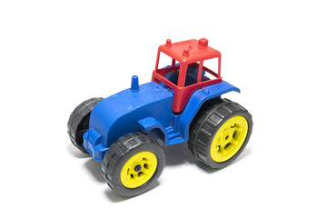 Colorful tractor toy isolated on white background.