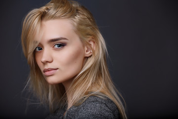 Fototapeta premium Close up girl model test. Blonde girl in jacket looking at the camera