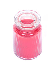 Red scented candle in jar separated on white background
