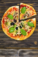 Pizza with Mushroom, Cheese, Mozzarella, Olives and Basil 