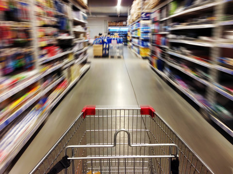 Shopping in supermarket. Shoping cart