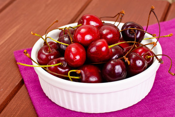 Fresh Cherry in Wooden Bowl