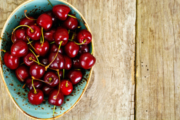 Fresh Cherry in Wooden Bowl