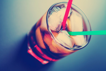 soft drinks. Cola glass with ice cubes on a white background