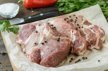 marinaded pork neck chops, uncooked