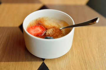 Breakfast. Organic oatmeal porridge with strawberries