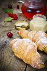 Tasty Sweet Croissant on Rustic Wooden Background