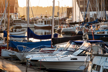 Obraz na płótnie Canvas Yachts berthed in yacht harbor.
