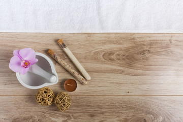 Fototapeta na wymiar Hand spa essential on wooden background. Beauty concept