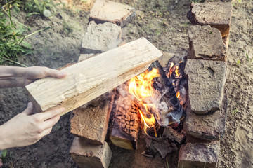 the hands are placed in the fire log