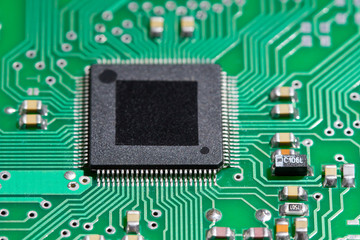 Close up a  microchip on an electronic board