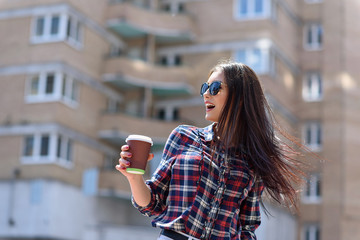 Obraz premium Happy woman relaxing in town
