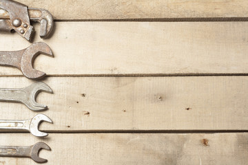 Set of construction tools. Wrench on wooden background