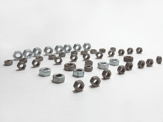 hex nuts of different sizes, beautifully positioned, in lines
