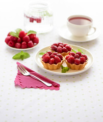 Fruit raspberry tart cakes on a table