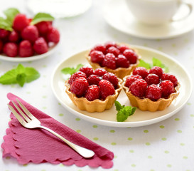 Fruit raspberry tart cakes on a table