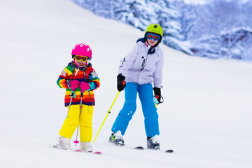 Kids skiing in the mountains