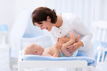 Mother and baby on changing table
