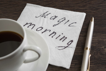 Coffee cup and napkin with message