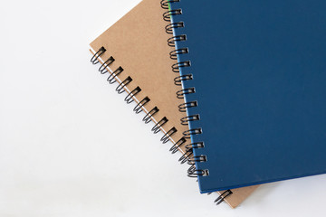 blue and brown color diary books on white background