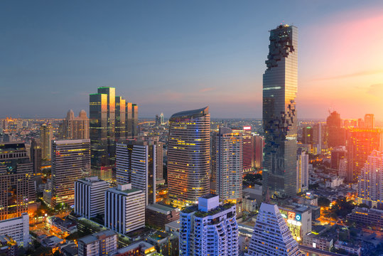 Aerial view of Bangkok modern office buildings, condominium in Bangkok city downtown,Mahanakorn tower with sunset sky , Bangkok , Thailand..