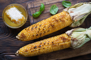 Above view of grilled corn on the cob with honey and paprika