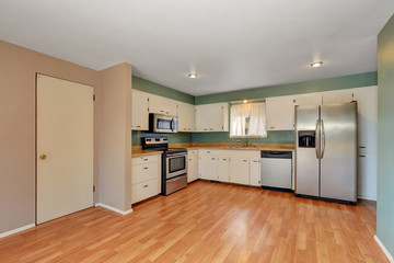 Remodeled kitchen with stainless steel appliances.