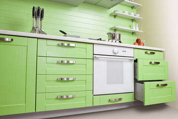 Luxurious new green kitchen with modern appliances