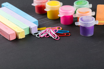 colorful crayons and gouache